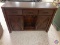 Oak TV stand/entertainment center with 3 drawers and shelves. 54 x 18 x 36...