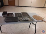 Assorted Baking Dishes and Wood Chopping Board.