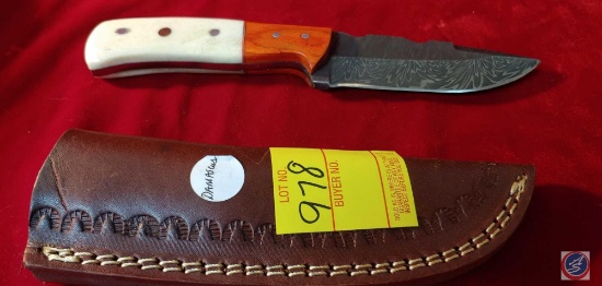 Hand Made Damascus Knife with beige and orange handle with leather sheath.