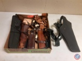 (5) gun holsters(3) are leather and(2) our fabric