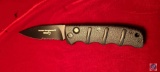 Boker Kalashnikov Ak-74 (D2 Black coated, Drop Point part serrated blade AUS-8 SS Blade, push button