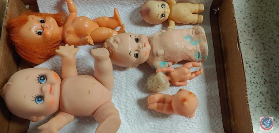 (1) Flat of assorted Baby Dolls, (1) Flat of Lexaire Heating and Air Conditioning Rodney Combs Model