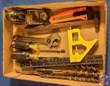 Flat of tools,... a wrench, screw drivers, drill bits, combination square, etc.....