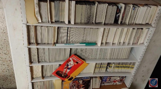 Box full of assorted hockey trading cards, various years and brand