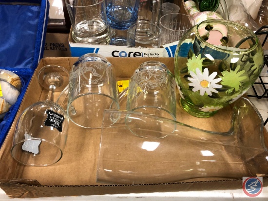 An assortment of glassware boxes and weight scale