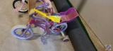 Monogoose Butterfly Summer girls bike with baby doll carrier and training wheels.