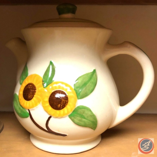 Elsie the cow cookie jar and a sunflower tea pot
