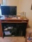 Desk, clock, dell monitor & printer 3 modems with wires computer paper and a Boston BA635 computer