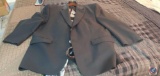 Four men's assorted suit jackets with ties.