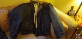 A men's jacket by burberry's size medium, a men's RPM collection jacket size medium, a men's winner