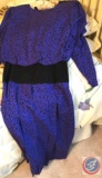 An assortment of women?s skirt and blouse outfits, pants suits, sizes ranging from small to large