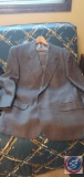 A men's brown sports coat with matching brown pants jackets range in size of 42 short to 44 short,