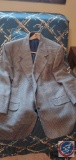 Four men's suit jackets men's sizes ranging in 42 short to 44 short,