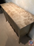A dining room credenza with acrylic marble looking top