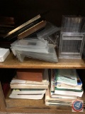 Assortment of books and picture frames