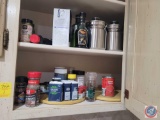Spices, can of tomato soup, tins, mixer
