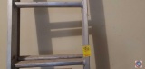 Approximately 8 ft extension ladder, unopened 16 ft if opened.