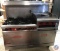Vulcan brand range and oven. This range appears to have six burners, a flat top griddle and two
