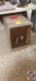 Medium size safe. There are two drawers on the top left of the safe, the combination is taped onto