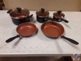 a set of(5) Farberware pots and pans appear to be new never used