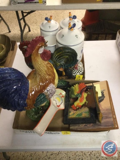 Chicken decor, including kitchen canisters, figurines, spoon rest, wall art, and napkin holder. One