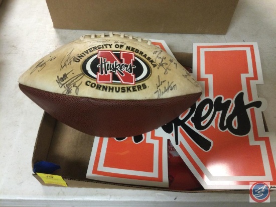 Nebraska huskers collectibles. Including signed football, plate, and large magnet. The football is