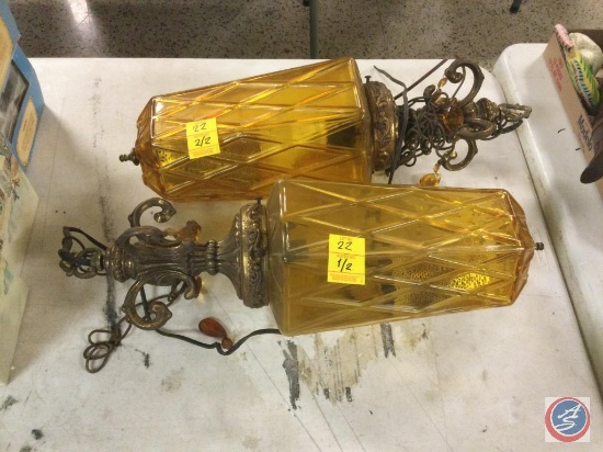 Amber and bronze colored outdoor light fixtures, unsure if either work one is missing some of the