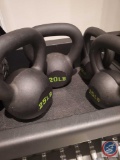 Set of four kettle bells. Weights include 10 lbs, 15 lbs, 20 lbs, and 25 lbs. The shelf is not