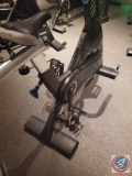 Spinning brand spin bike. The bikes do have easy to move wheels on the front. There are several