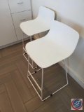 Two bar height chairs by the Article brand....