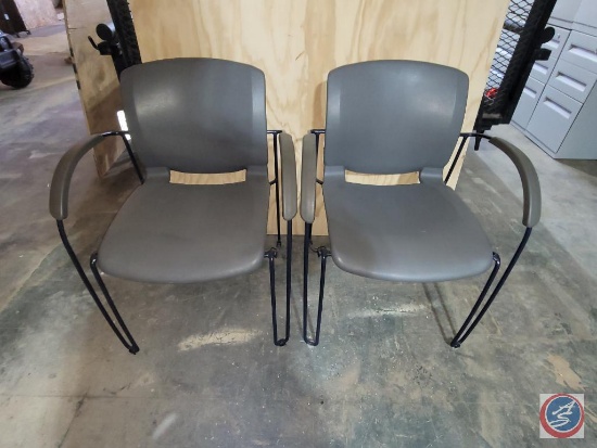 2 metal and plastic molded chairs.