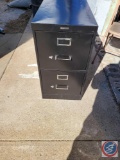 Black file cabinet and chairs