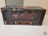 (1)1:24 scale Signature Series 1920 Seagrave fire truck with a 24 carat gold-plated coin piece