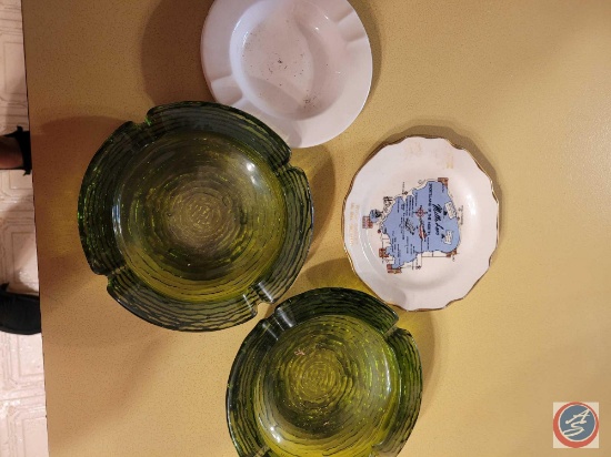 Assortment of glass, and ceramic ashtrays. There are some scratches in the designs. There is one