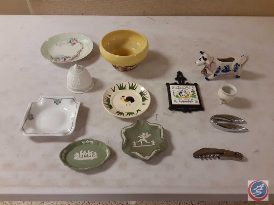 Assortment of trivet, ashtrays, corkscrew, saucers, bowl, bottle opener and bell