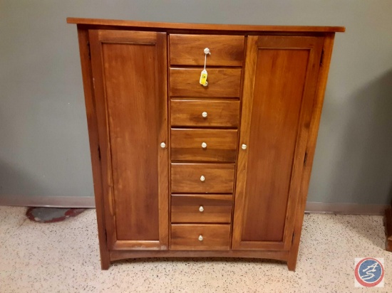 Wood Cabinet with 2 doors one to hang jewelry on, 7 drawers, 3 shelves on each side for clothing,