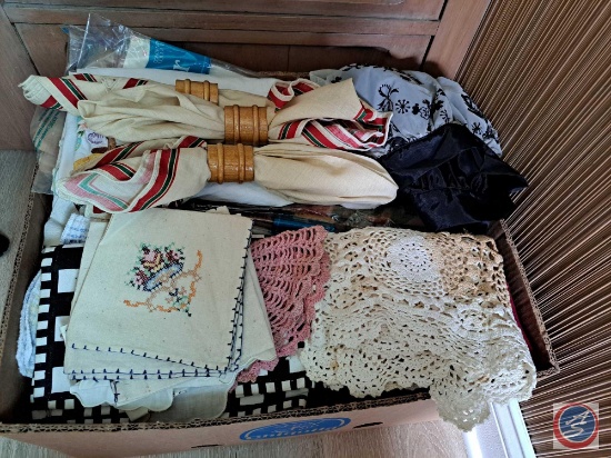 (1) Box of assorted doilies, kitchen towels, placemats, Clown Cookie Jar, Wood Chair tips,
