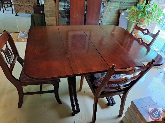 Wood Dining Room Table approx measurements are: 53 L X 42 W X 30 H, 7 Wood Chairs. Several Leaves