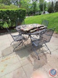 Wrought iron table with 4 chairs with 2 cushions