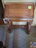 Small wood desk with drop down front approx measurements are; 31 W X 7 D X 39 H. Wood Chair with