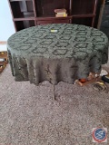Round Table with metal legs damaged on top of table, green table cloth approx measurement is 41 X