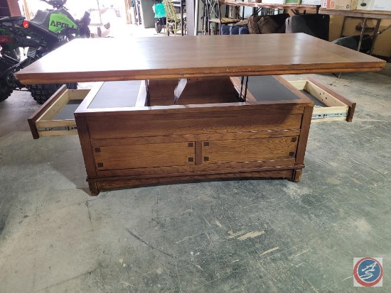 Oak wood coffee table with drawer on all 4 sides top does rise up to meet you so you do not have to