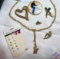 Gold tone brooches and little tites earrings
