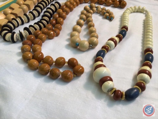 assorted wooden beaded necklaces