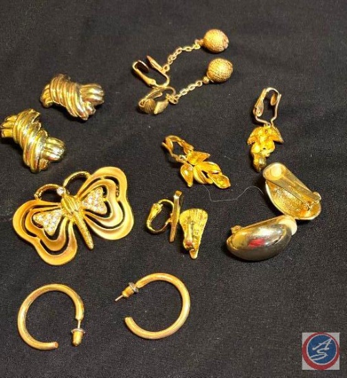 Gold tone earrings and butterfly
