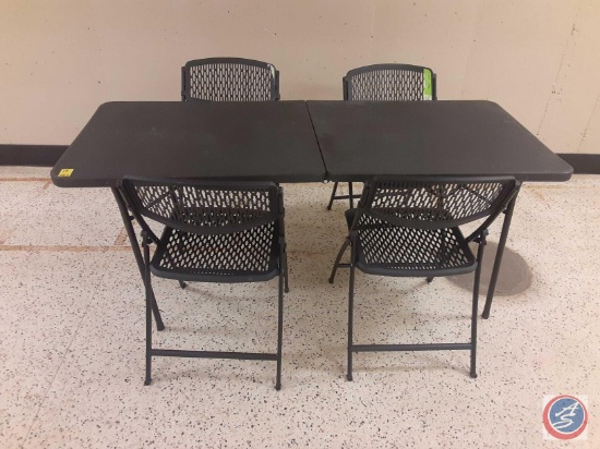 (1) black 6 ft plastic folding table with four plastic folding chairs.