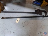 (1) large pipe wrench and a large chisel