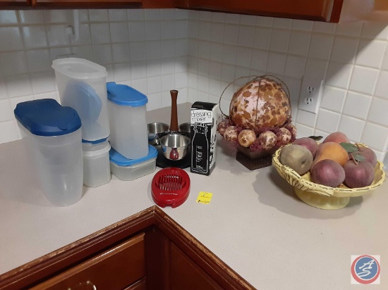 Tupperware canisters, dressing mixer, artificial fruit KitchenAid slicer.