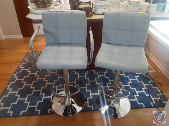 (2) light blue adjustable bar stools one has arms (these are sold two times the money)