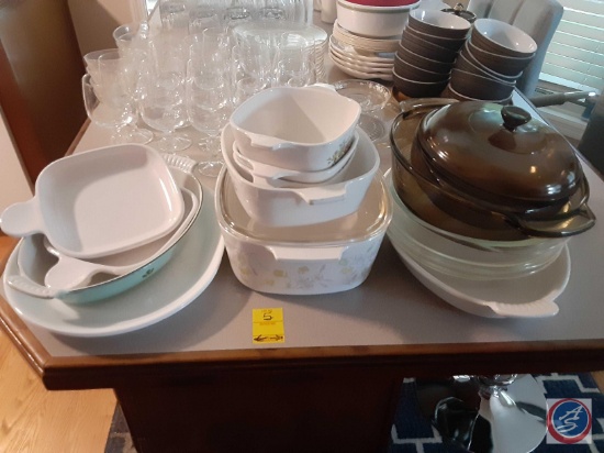 Assorted CorningWare dishes and other miscellaneous dishes.